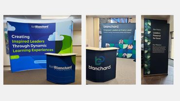 Ken Blanchard Companies' leadership training displays with inspiring messages and branding.
