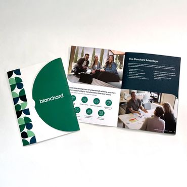 Open Blanchard brochure showing leadership development and teamwork concepts.