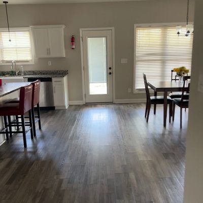 Furnished kitchen and dining area inside The Village Living transitional housing home in Clarksville