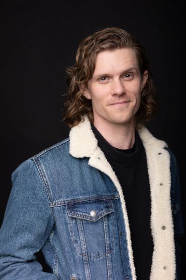 Man wearing denim jacket with shearling lining.NYC Headshot & Branding Photographer | Taisha Marie Photos