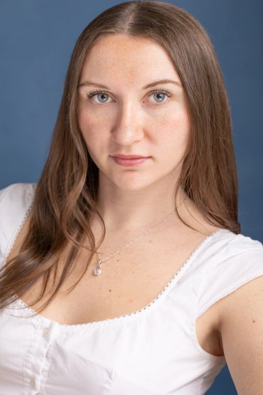 Young woman with long brown hair in white top. acting headshots. NYC Headshot & Branding Photographer | Taisha Marie Photos