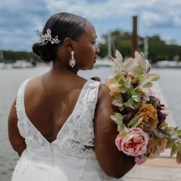 Bride holding bouquet by the water. wedding photography. NYC Photography Pricing | Taisha Marie Photos