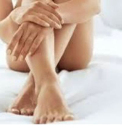 Woman sitting down after her Hands and Feet Wax Service in Blossom Beauty Skincare at Fort Lauderdal