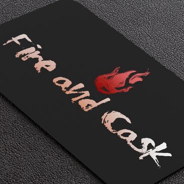 Business card with 'Fire and Cask' logo and flame graphic on black textured background.