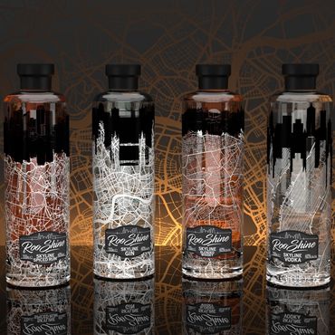 Six Roo Shine liquor bottles with city skyline and map designs.