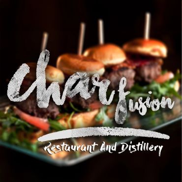 Close-up of gourmet sliders with restaurant logo overlay.