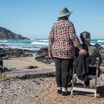 Two ladies by a beach.