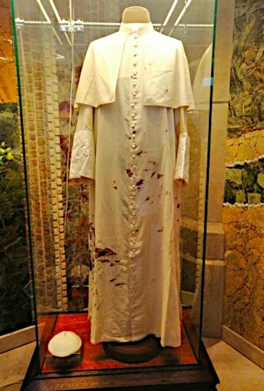 A set of Papal vestments showing bloodstains of John Paul ii.