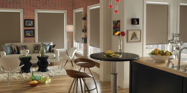 Modern living room and kitchen area with neutral tones.