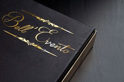 a cardboard box with gold lettering