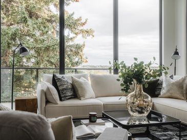 Living room with modern sofa and tasteful accessories and decor.
