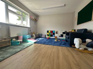 Baby room cosy corner, music area with sensory wall and mirrors