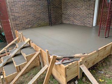 6" concrete capped porch with 3 steps.