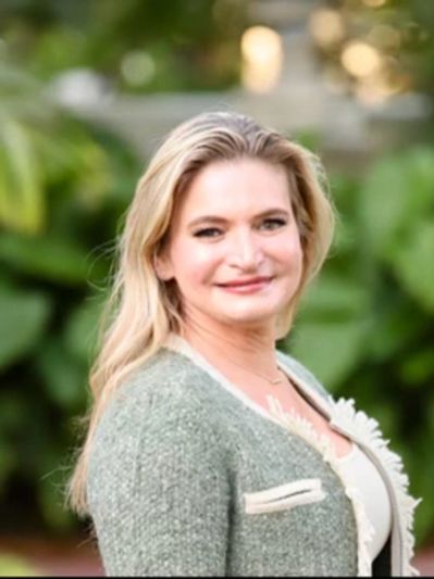 A Woman in an Olive Green Color Jacket With White Trim