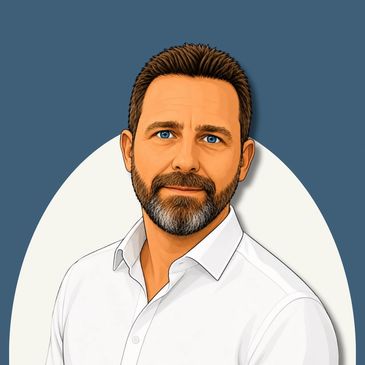 Portrait of a man with blue eyes and beard in a white shirt.