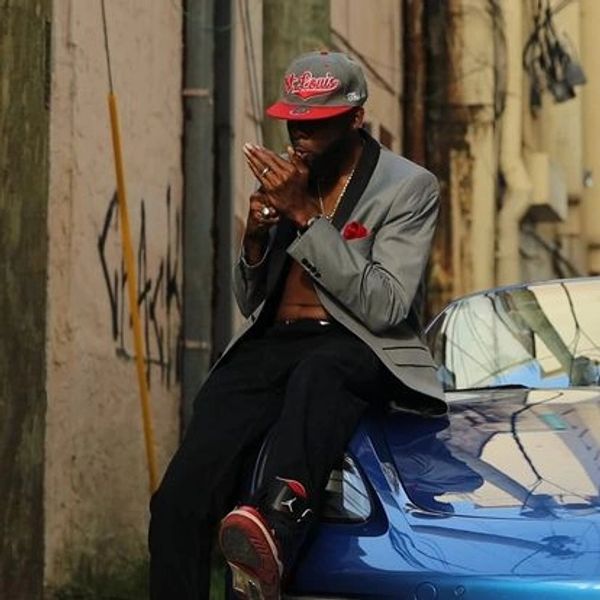 3Fifs wearing St. Louis hat smoking a Cohiba while shooting "Season of the Fall" music video.