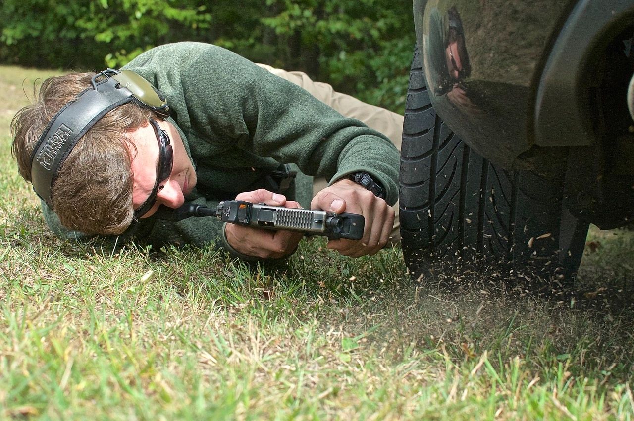 Tier 1 Citizen student shooting a Glock 17 known as the GS17. Vehicle Ground fighting.
