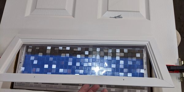 Privacy window insert installed in 6-panel hollow core interior door