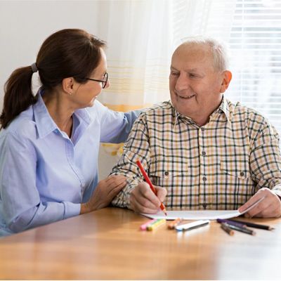 Occupational therapist with elderly man