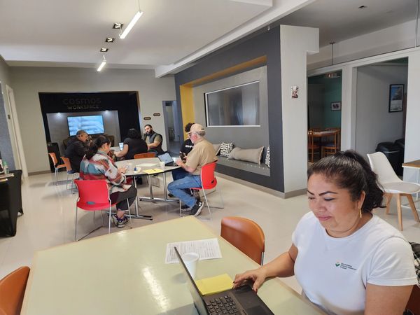 People working on laptops in a coworking space