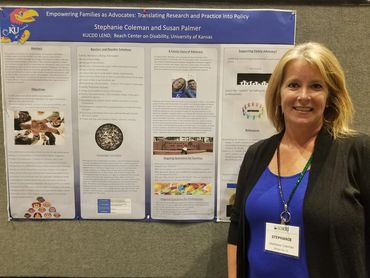 Woman standing next to a research poster.