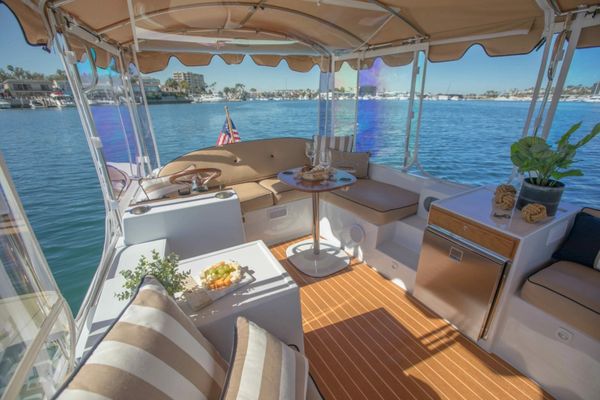 Cozy boat seating area with water views.