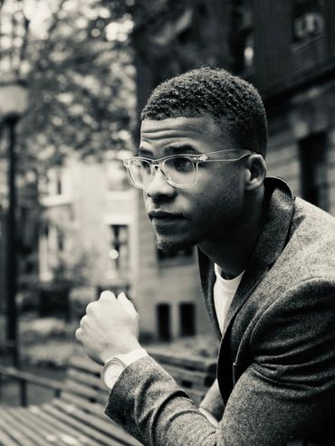 closeup shot of a man with specs