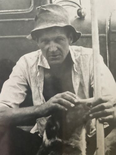 Will Howard with a hat and a stick