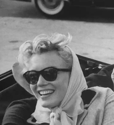 black and white picture of a woman with glasses