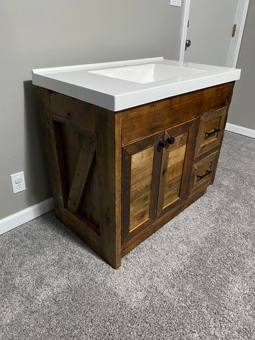 Custom reclaimed barn wood vanity for bathroom built by Henry's Legacy Woodworking.