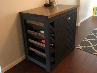Custom Modern black and dark wood mini bar with exposed wine rack and liquor cabinet.