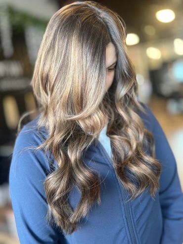 Close-up of wavy highlighted hair.