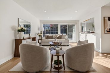 Bright, modern living room with neutral tones and natural light.
