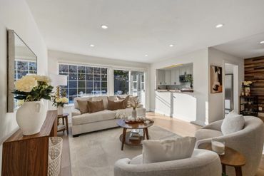 Bright and cozy living room with neutral tones and natural light.