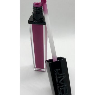 Open tube of pink lip gloss with applicator wand.