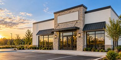 Empty storefront with sunset background.