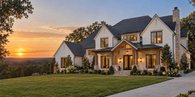 Beautiful house at sunset with well-kept lawn.