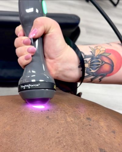 Close-up of a therapy device on a person's back.