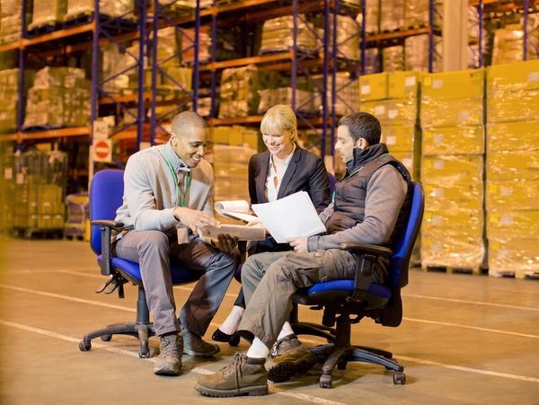 Business people talking in warehouse