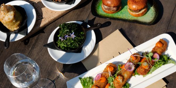 A table with gourmet appetizers and beverages.