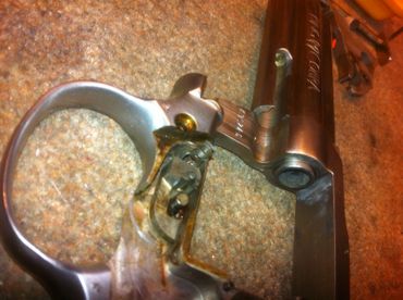 Repairing a broken part on a revolver.