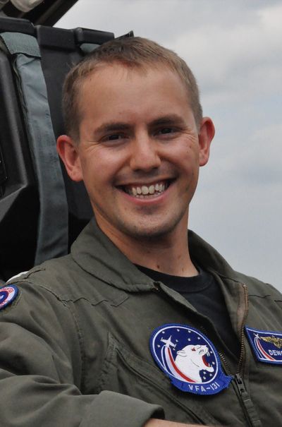 Image of Steven Shaw sitting in the cockpit of an F/A-18C wearing a flight suit.