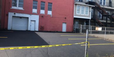 Parking lot seal and stripe