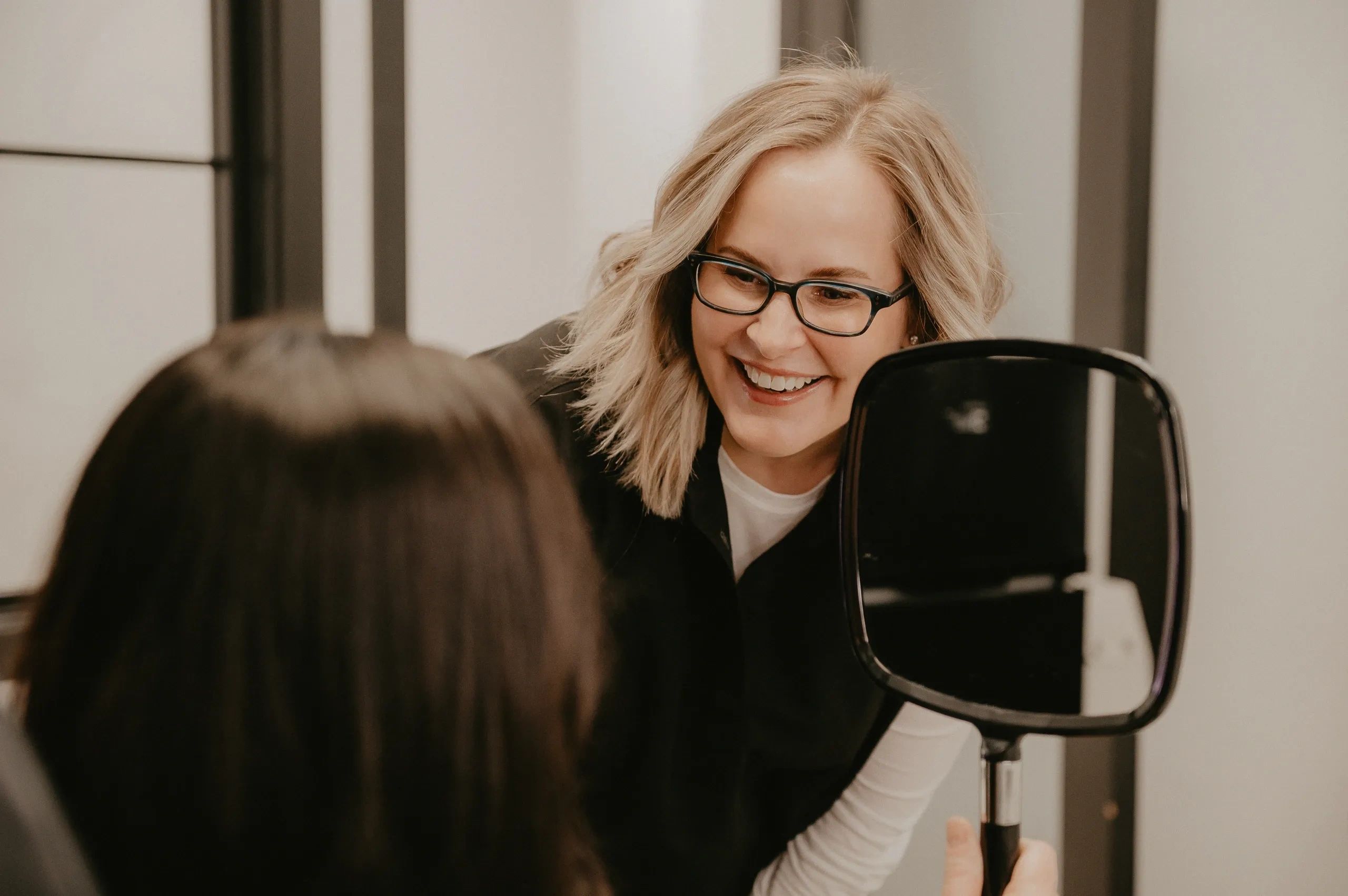 Smiling woman doing assessment for best botox in Edmonton