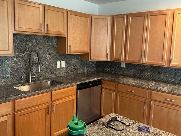 Before, staggered cabinets and a misplaced dishwasher blocked each other. Now, the layout flows seam