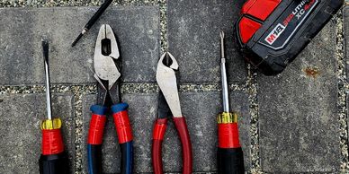 Tools lined up in a row on the ground