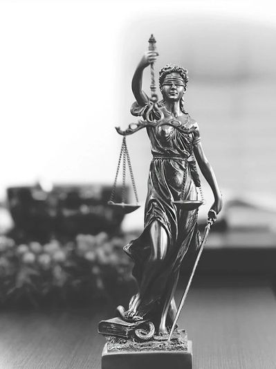 black and white picture of a lady justice idol