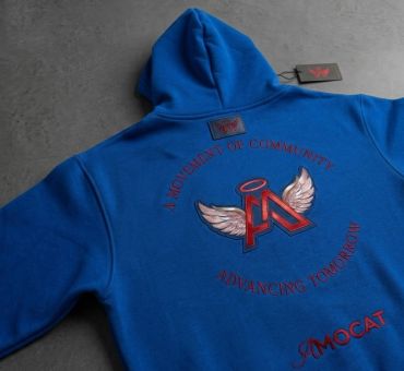 Blue hoodie with winged emblem and text.