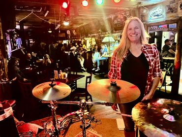 Christina in front of the drumset