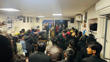 Group attending a POSH training session in a small room.